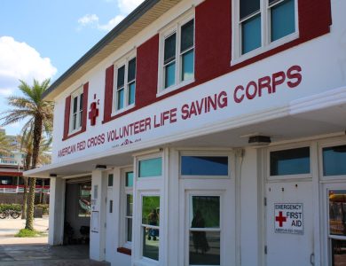 A red and white building with a red cross on it