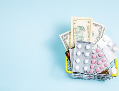 a shopping cart filled with pills and money