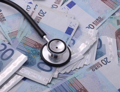 silver and black stethoscope on 100 indian rupee bill