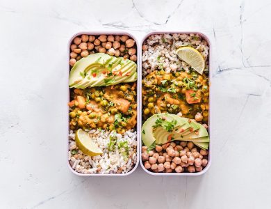 A prepared meal arranged in a reusable food container.