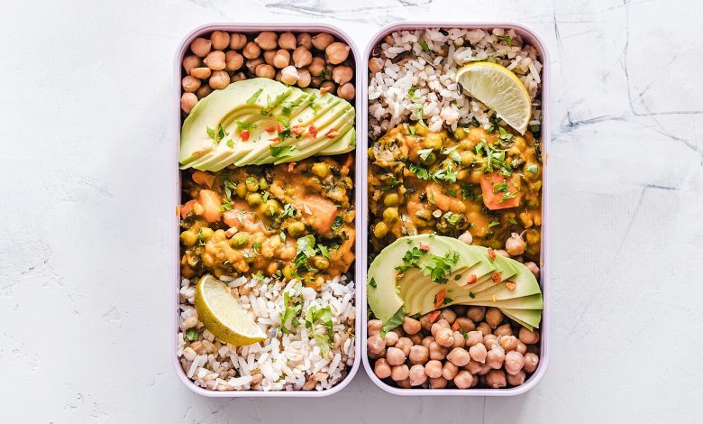 A prepared meal arranged in a reusable food container.
